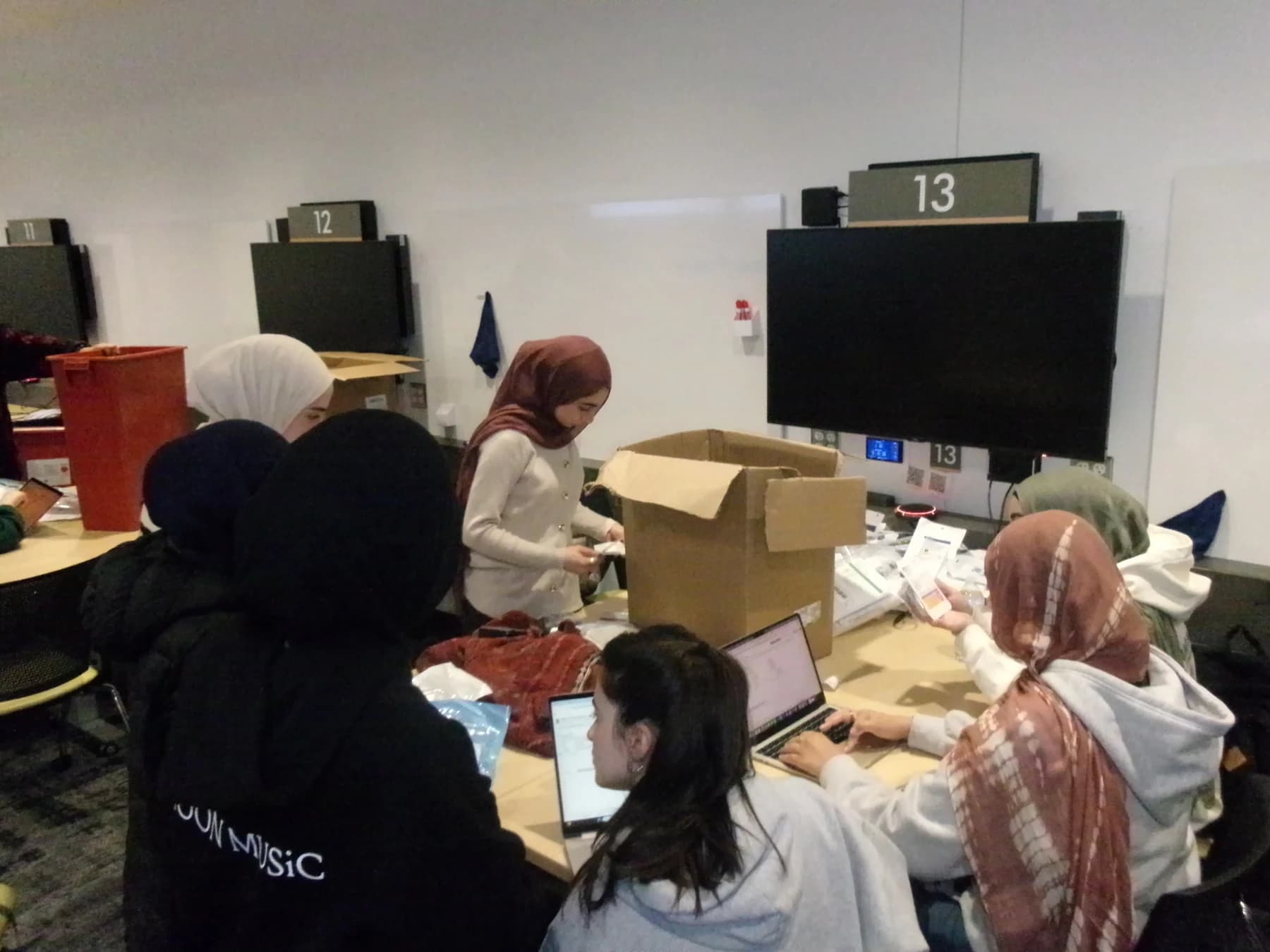 Project Resurge volunteers sorting and recording donated medical supplies together